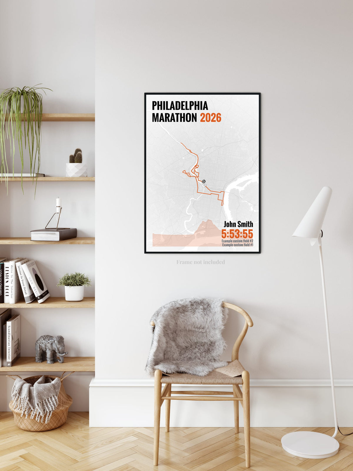 Philadelphia Marathon route print in orange beside a bookshelf