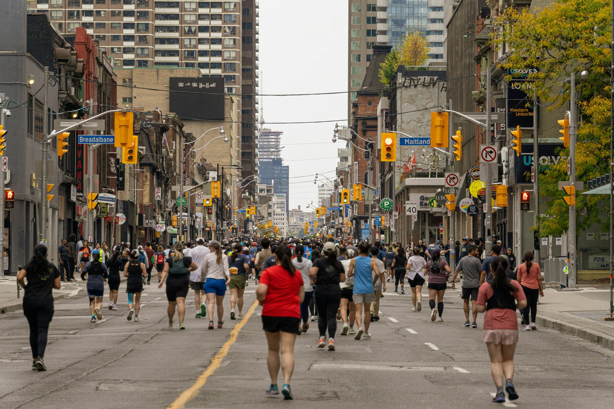 Runners filling a city street during a marathon
